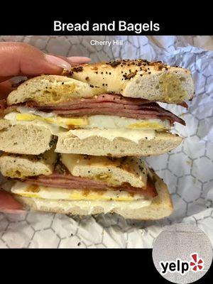 Pork roll, egg and cheese with yellow mustard on an everything bagel