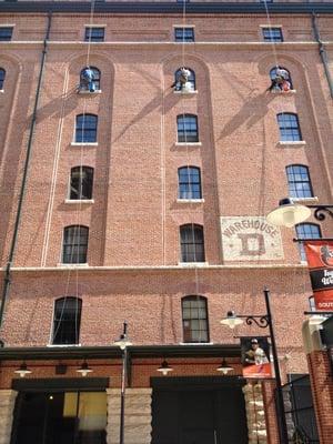 VIP Special Services Window Cleaners rappelling via a boatswains chairs at the Camden Yards Warehouse in Baltimore, MD.