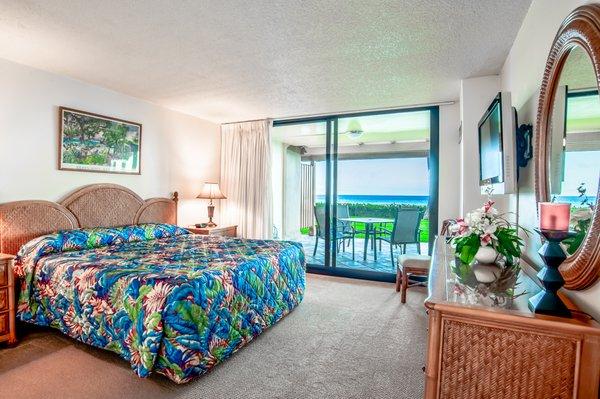 Unit 114 at The Mahana master bedroom with a king size bed, flat screen TV and own access to the lanai.