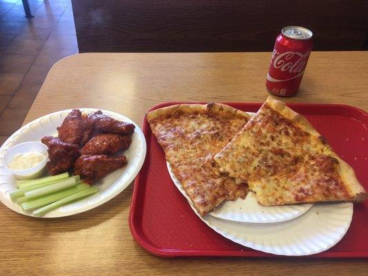 Chicken wings 2 slices and coke can..$11.00 Great clean food The Spanish guys are super nice