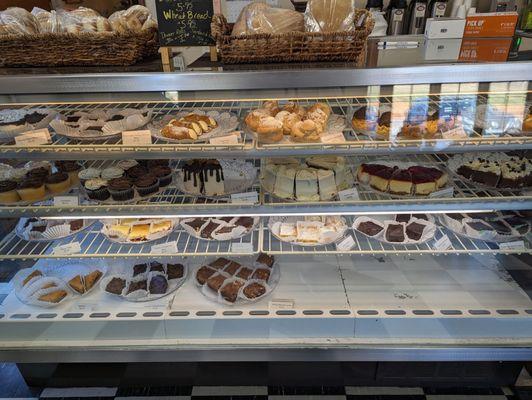 Dessert case, bread loaves and rolls for sale, too