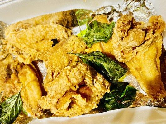 Deep Fried Wings Topped With Fried Basil.