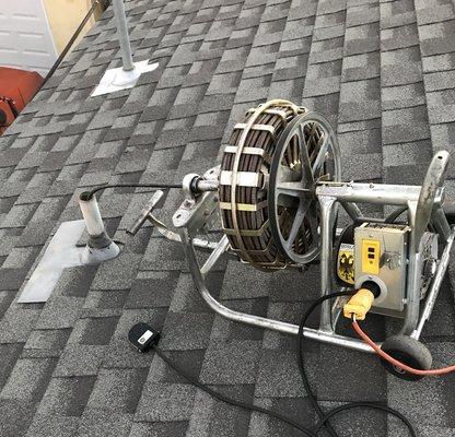 Unclogging of a washing machine drain line from roof top