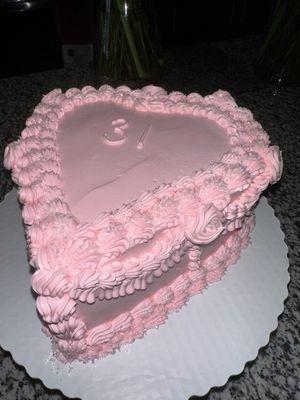 Color/icing: pink whipped icing  Cake: white  Style: Heart-shaped