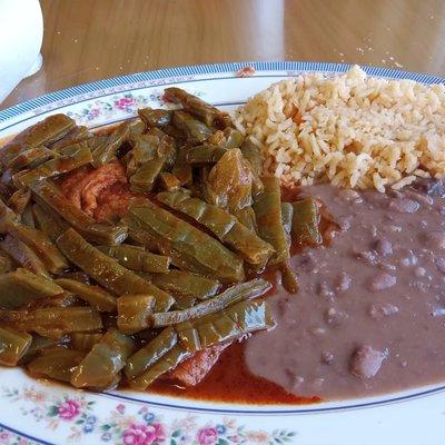 Shrimp patties with nopales, rice, and beans