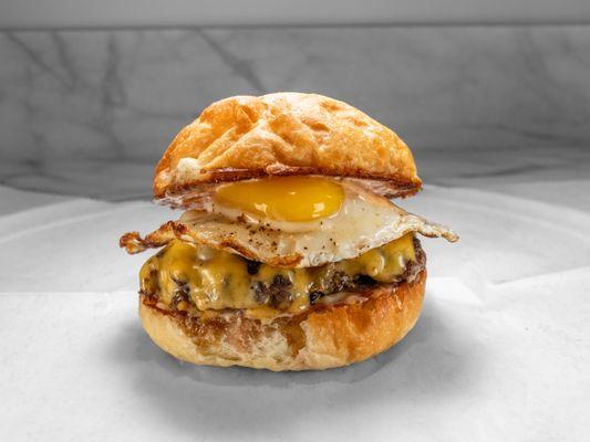 Georges Burger. 4 oz black angus beef patty with american cheese and a sunny side up egg.