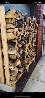 This is what was stacked by "Royal Firewood", they filled my rack, and I had some extra stacked on the side.