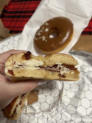 Asiago bagel toasted with veggie cream cheese and bacon added