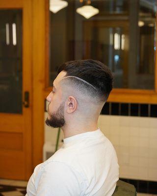 High fade with a graphic by Medo