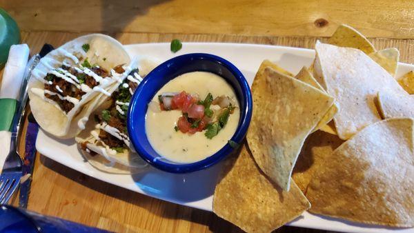 Tacos and chips with queso