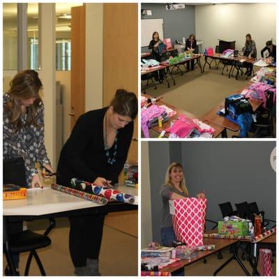 Members of WinterWyman spend their morning wrapping presents in our Waltham office for Birthday Wishes.