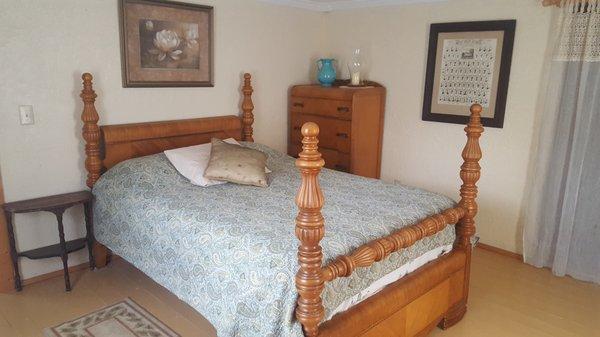 Retreat Room has comfy queen size bed, Wifi, TV, A/C, electric fireplace and private bath down the hall.