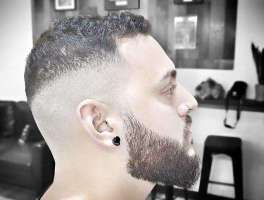 One of the hardest cuts to do! Freddie made it look easy to do when he constructed this high, short fade and sleek beard trim and line up.