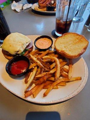 The V-8 Special hamburger with swiss cheese, thousand island dressing, onions, lettuce, and tomato.