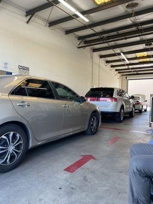 Cars lined up for smog checks.