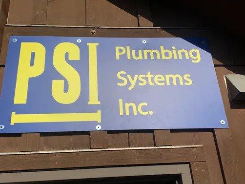 Plumbing Systems Inc sign above door