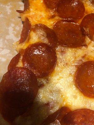 Puddle of grease in the pepperoni