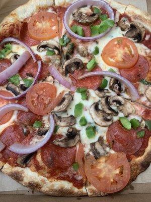 Pepperoni, mushrooms, green peppers, tomatoes and onions.