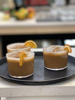 Iced orange-caramel cortados