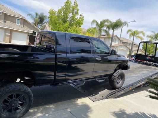 Wind and Sea Tow Truck loading Dodge Ram.