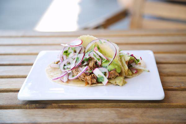 Kalua Pork Tacos
 red onion, cilantro, radish, and house chili verde