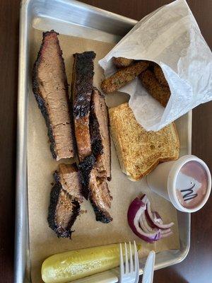 Brisket dinner included a side, whole fried okra. Mild sauce on the side. Pickle, onion and toast.