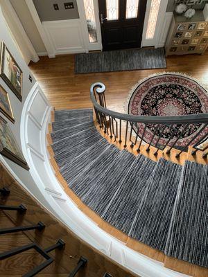 Curved steps with a carpet runner.