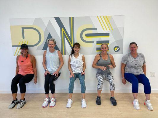 These crazy gals are doing wall squats after class!