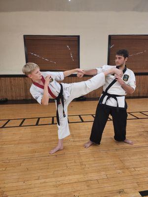 Theron working on his throat kicks