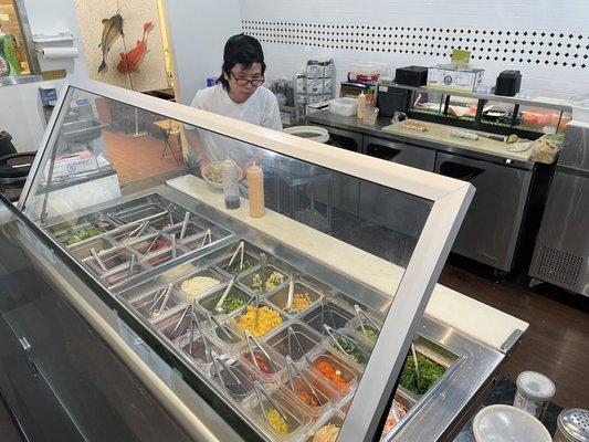 The ingredients are always kept closed in a fridge unless they are building a bowl. Keeps it all fresh! My #1 poke place.