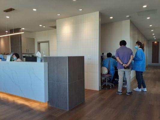 Check-in area(left), right down hallway Dr.Anh uses/shares patient's 3D scan to train & discuss with assistants & staff implant viability.