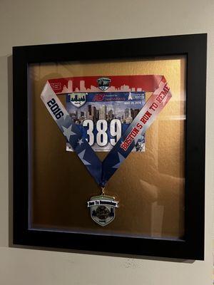 My half marathon number and medal.