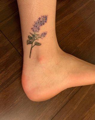 My lilac stem tattoo by Kelly.