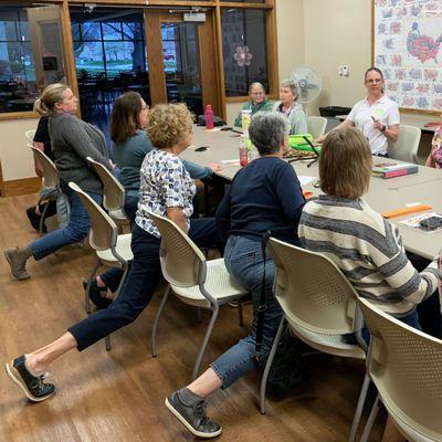 Katherine presents information on stretching to a classroom full of quilters.