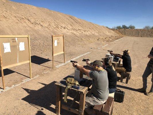 NRA Basics of Pistol Shooting Course. 
 Students learning to shoot from the benchrest position.