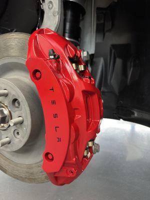 Red brake calipers for Tesla Model X.