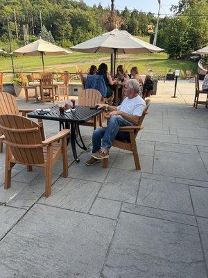 My husband, relaxing after a hard day work enjoying the view and having a wonderful meal