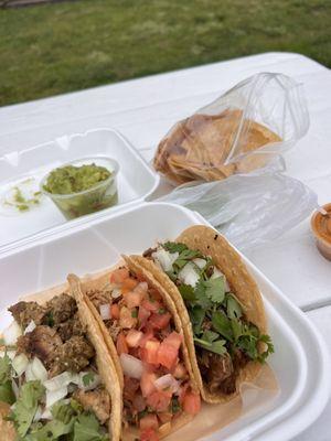 Pastor , chili verde, and carnita taco  With a side of chips and guacamole