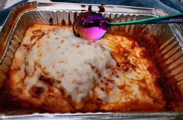 The spoon pictured is a tablespoon so you can see how small and short piece of lasagna was  I ordered extra Mozzarella on it.