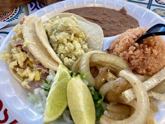 3 tacos plate with rice and beans:  One ham and egg taco, and one potato and egg taco.