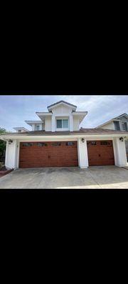 Newly installed carriage doors for a 3-car garage.