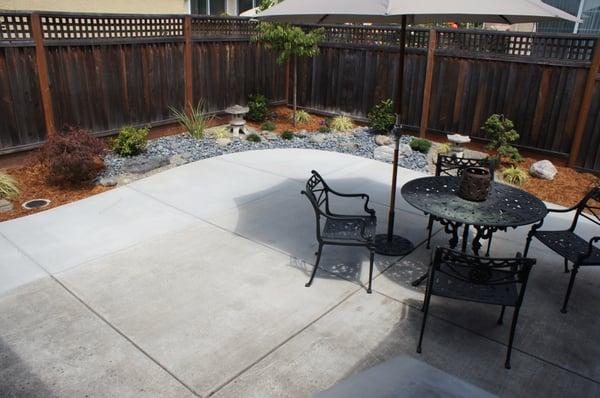 To a small patio area, added more concrete seating area and planting