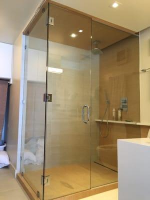 Another great design and installation of a custom frameless glass shower enclosure by the talented staff at National Glass & Mirror.