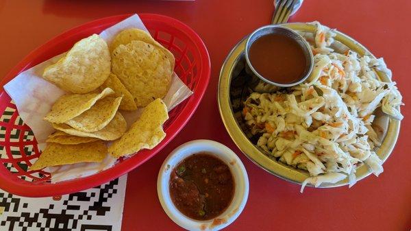 Tortilla Chips with spicy Salsa for the chips.
 
 Plus, curtido and mild salsa for the pupusas.