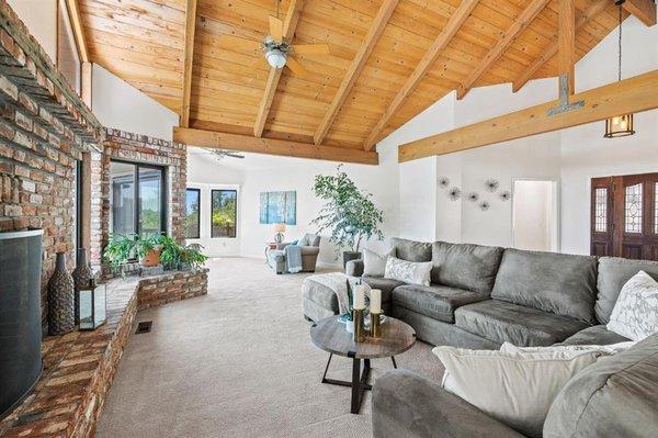 Staged home with dramatic vaulted ceiling.