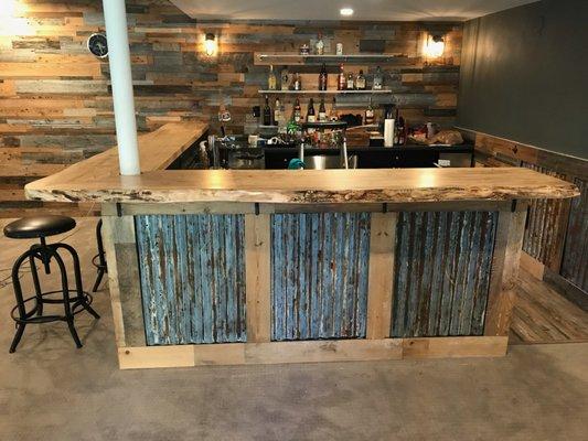 Large custom basement bar top in live edge maple.