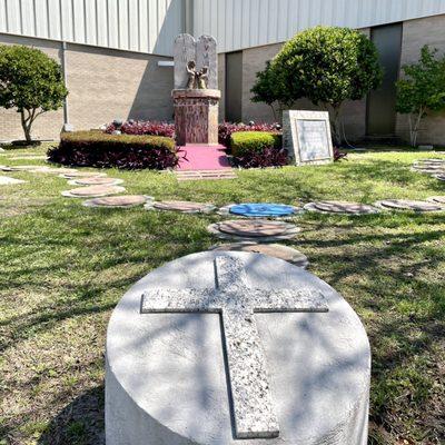 Rosary walk around a statue of the Ten Commandments