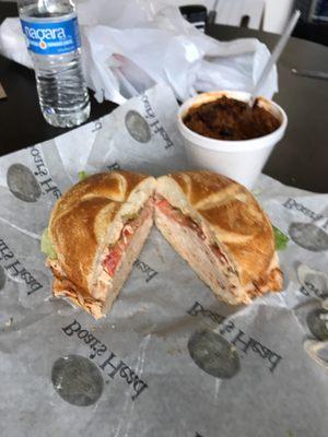 Cajun chicken sandwich and a bowl of chili.