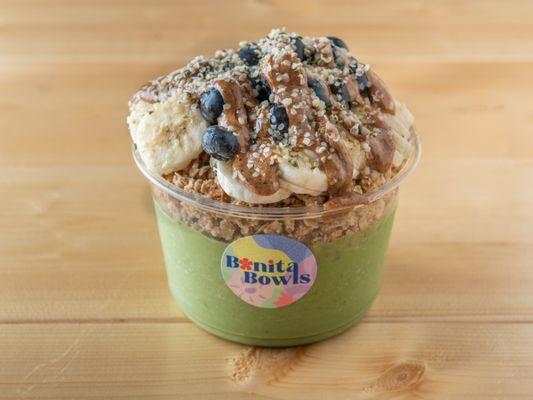 GREEN LUSH - GREEN BASE TOPPED WITH GRANOLA, BANANA, BLUEBERRY, ALMOND BUTTER, HEMP SEEDS, & HONEY.