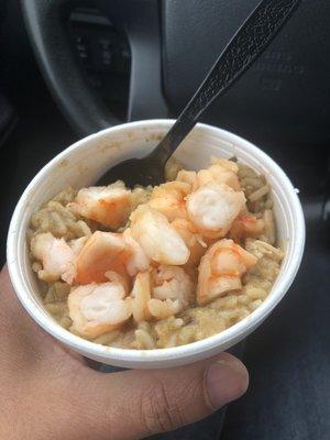 Seafood gumbo... basically a pint of rice with gravy, chicken, veggies, and sausage mixed in... topped with chopped up shrimp. Huh? ‍